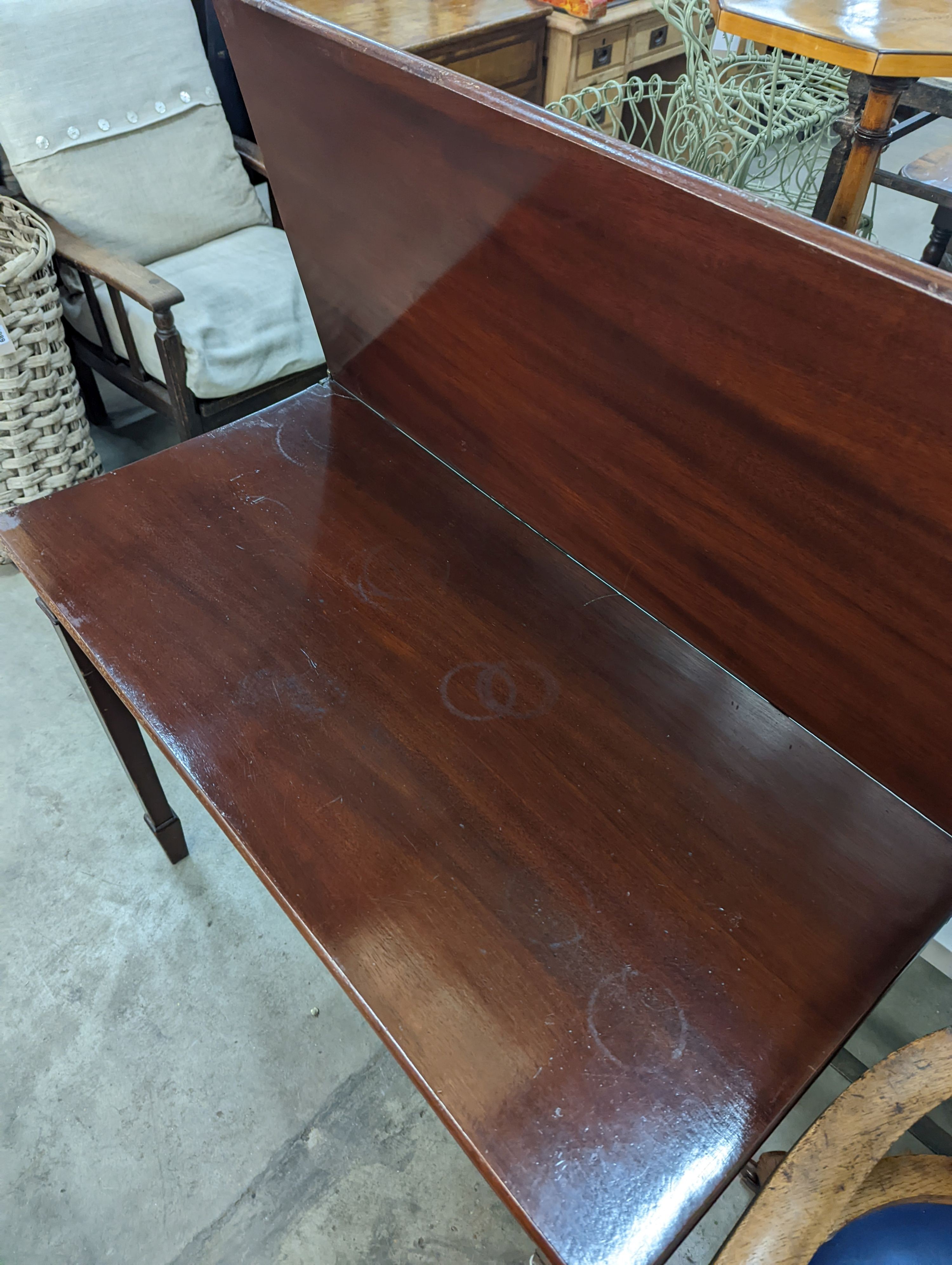 An Edwardian rectangular mahogany folding tea table, width 92cm, depth 46cm, height 75cm